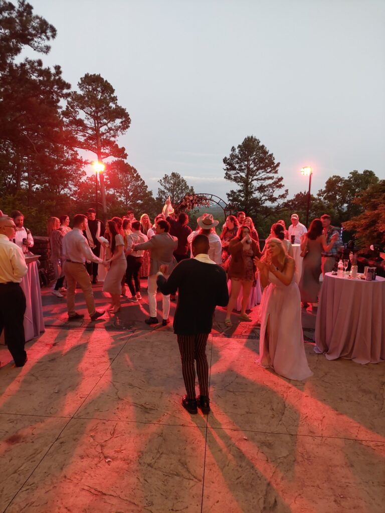 guests on dance floor at outdoor wedding