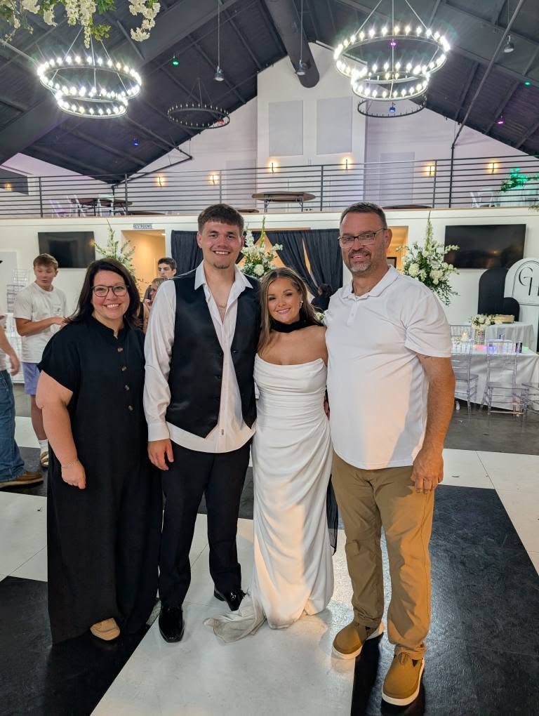 bride and groom with wedding DJ 